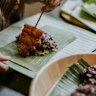 Isaan-style char-grilled pork served with sticky rice.