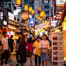 Bustling street scene at Sejong Village Food Street in Seoul.