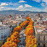 Autumnal foliage line the streets of La Rambla.