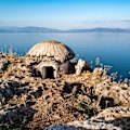 A mushroom-shaped bunker on the rocky shore of Lake Ohrid, Albania.