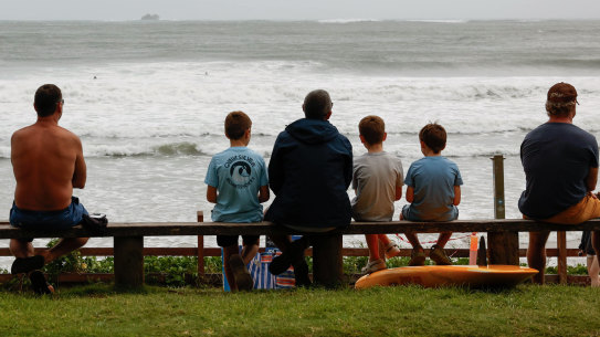 Kids enjoy a break in the weather at Byron bay  before the arrival of Cyclone Alfred.