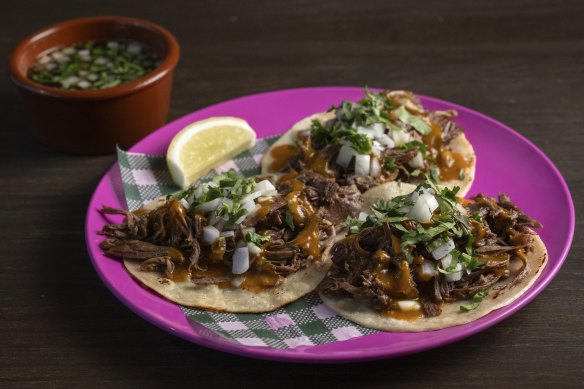 El Columpio’s lamb barbacoa tacos with chilli consomme.