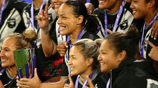 Kiwi Ferns captain Honey Hireme (with the trophy) and her teammates celebrate their thrilling win on Saturday night.