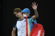 Alex de Minaur waves farewell to Melbourne Park for another year after his loss to Jannik Sinner.