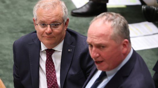 Prime Minister Scott Morrison, left with Barnaby Joyce, told Parliament on Monday he would stick with the target that he took to the 2019 election.