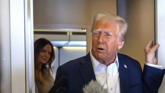 President Donald Trump speaks to reporters aboard Air Force One as he travelled from Las Vegas to Miami. 