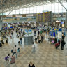 Passengers in the departures hall at Helsinki airport in Finland.
