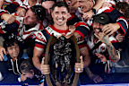 Victor Radley celebrates with the 2026 premiership trophy.