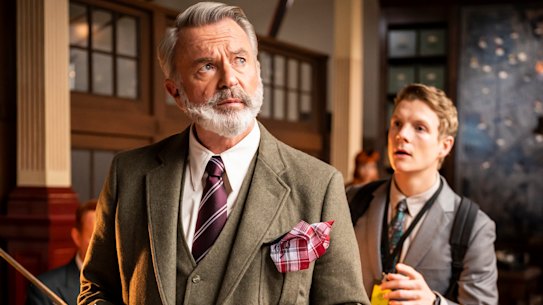 Dennis Tanner (Sam Neill) and Paul Carpenter (Patrick Gibson) in JW Wells & Co Back Office in a scene from The Portable Door.