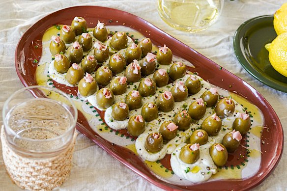 A cool schmear of dirty martini dip topped with mortadella-stuffed olives. Trust us, you need this.
