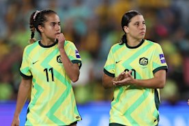 Mary Fowler, Sam Kerr and Caitlin Foord process the 3-3 draw.