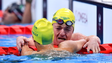 Grant Patterson left, and Ahmed Kelly, both of Australia, embrace after finishing third and second respectively in the men’s SM3 150 metre individual medley final at the Tokyo Aquatic Centre.