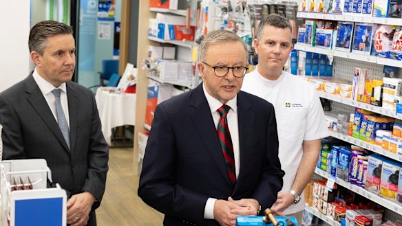 Butler (left) with Anthony Albanese at a pharmacy in September.