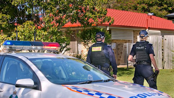 The “younger man” was shot by police in Arana Hills about 12.30pm.