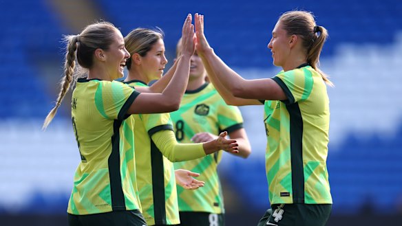 Courtney Nevin and Clare Hunt high five.