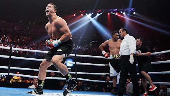 Darcy Lussick celebrates victory over Justin Hodges.