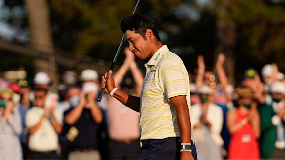 Hideki Matsuyama walks off the 18th green.