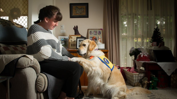 Shirley McMahon with her assistance dog 'Coopa' who is trained to recognise seizures and is also there to help with depression.
