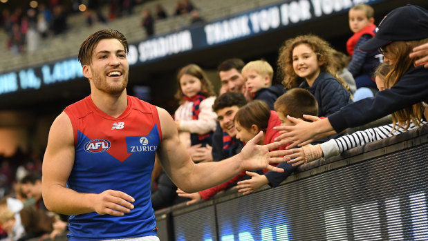 Dee-light:  Jack Viney with happy Melbourne fans after thumping win over Carlton.