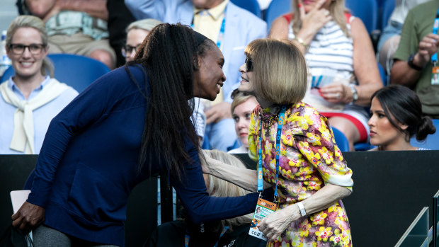 Anna Wintour (right) greets tennis champion Venus Williams in Serena Williams' player's box at the Australian Open.