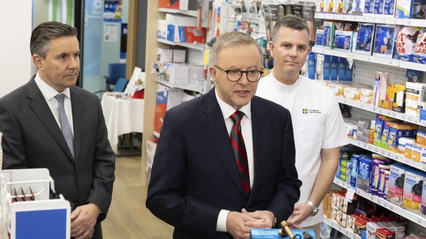 Butler (left) with Anthony Albanese at a pharmacy in September.