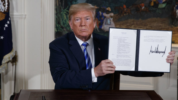 US President Donald Trump shows the signed Presidential Memorandum.