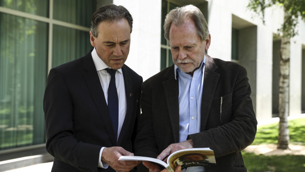 Health Minister Greg Hunt with Ken Fleming, who has written a book about his son Jack, who died of a brain tumor. 