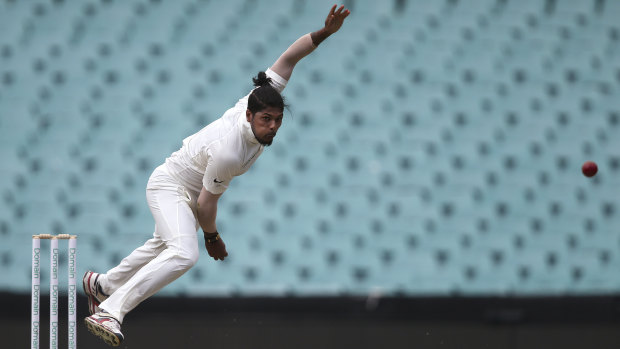 With pace: India's Umesh Yadav follows through the crease at Adelaide Oval.