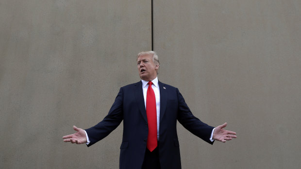 US President Donald Trump  reviews border wall prototypes in San Diego in March. 