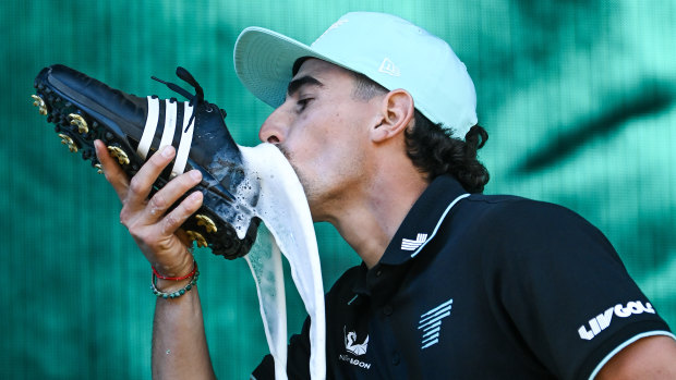 Joaquin Niemann celebrates his victory in the Adelaide LIV tournament on Sunday with a “shoey”.