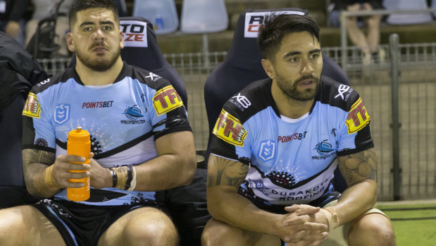 Shaun Johnson (right) has to watch on from the bench after being replaced at the business end of their defeat by Brisbane.