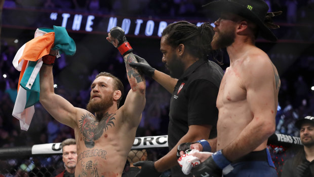 Fame and fortune: 'Notorious' Conor McGregor celebrates his first round TKO victory against Donald Cerrone during UFC246 in Las Vegas.