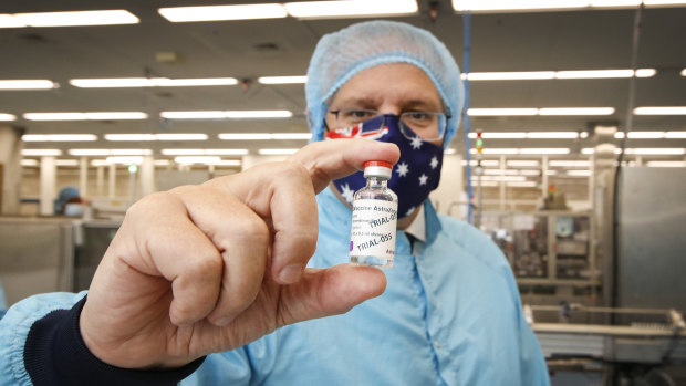 Prime Minister Scott Morrison with the AstraZeneca vaccine at CSL laboratories.
