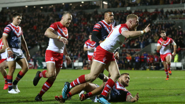 Luke Thomson of St Helens crosses for his side's first try.