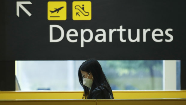 People check-in for flights at Melbourne Airport.