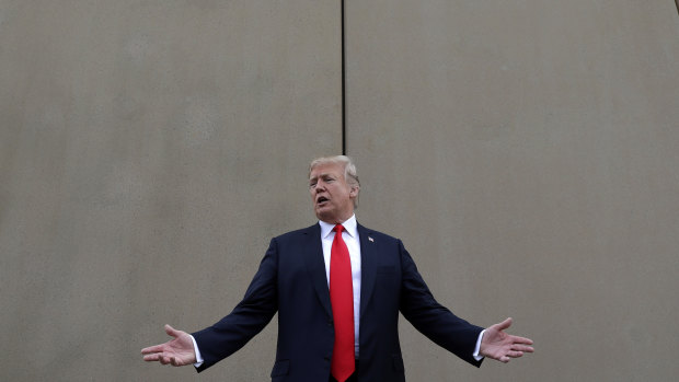 President Donald Trump speaks during a tour as he reviews border wall prototypes in San Diego in March. 