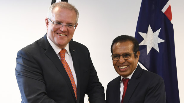 Australian Prime Minister Scott Morrison, left, and East Timorese Prime Minister Taur Matan Ruak shake hands after a bilateral meeting in Dili, East Timor, last year.