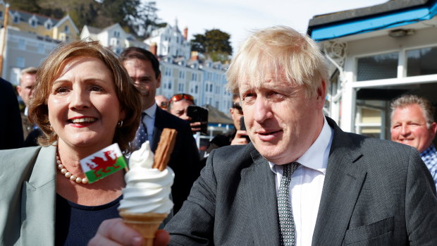 Britain’s Prime Minister, Boris Johnson holds an ice-cream as he campaigns in Wales ahead of elections in Llandudno, United Kingdom. 