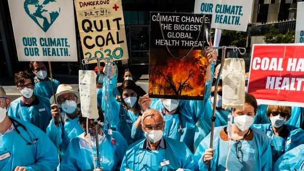Dozens of public healthcare workers staged a demonstration outside AGL’s Melbourne offices calling for a faster exit from coal.