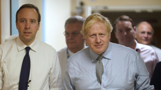 Health Secretary Matt Hancock and Prime Minister Boris Johnson during a tour of a hospital.