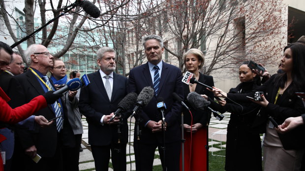 Mitch Fifield, Mathias Cormann and Michaelia Cash announcing their resignation to the media on Thursday.