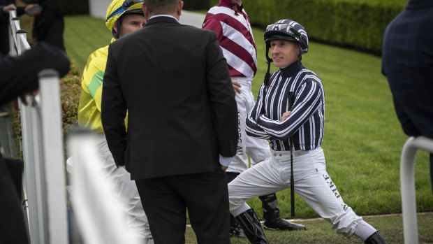 Jockey William Pike talks to connections at Canterbury.