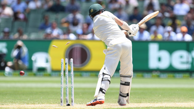 Straight through: Travis Head of Australia is bowled by Jasprit Bumrah in the first innings.