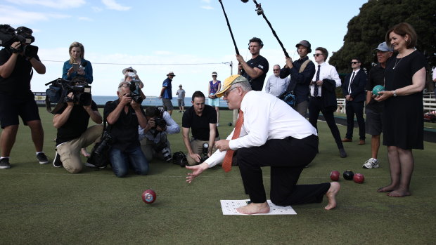 Prime Minister Scott Morrison shows off his barefoot bowls technique in Torquay.