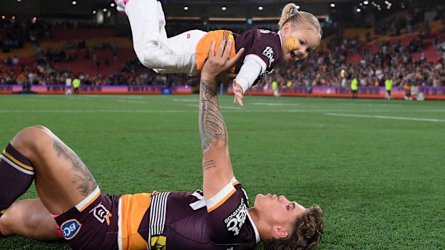 Reece Walsh celebrates with his daughter Leila after a match in 2023.