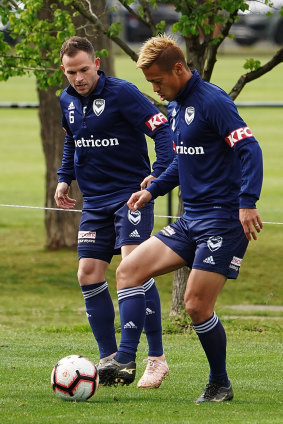 Keisuke Honda (right) trains with Melbourne Victory this week.