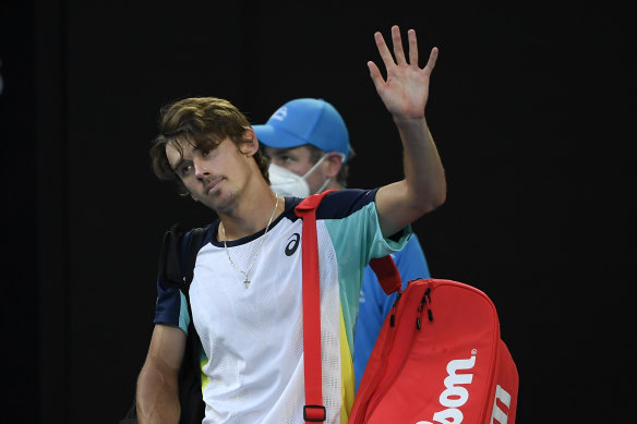 Alex de Minaur waves farewell to Melbourne Park for another year after his loss to Jannik Sinner.