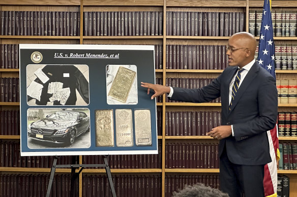 Damian Williams, a US attorney in New York, shows photos of evidence collected against Bob Menendez.