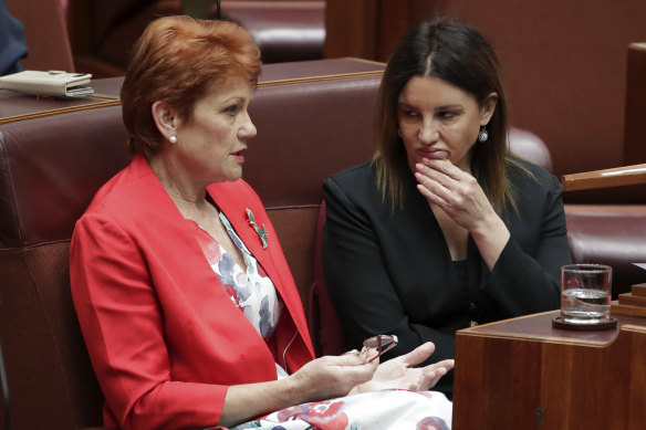 Senators Pauline Hanson and Jacqui Lambie in discussion during debate on Medevac.