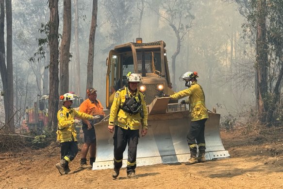 Bulldozing containment lines near the Capeen Mountain fire north west of Casino.